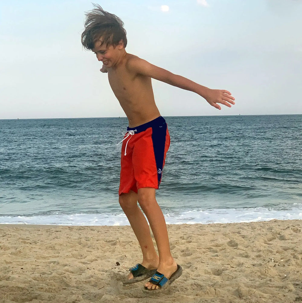 Boy jumping on the beach