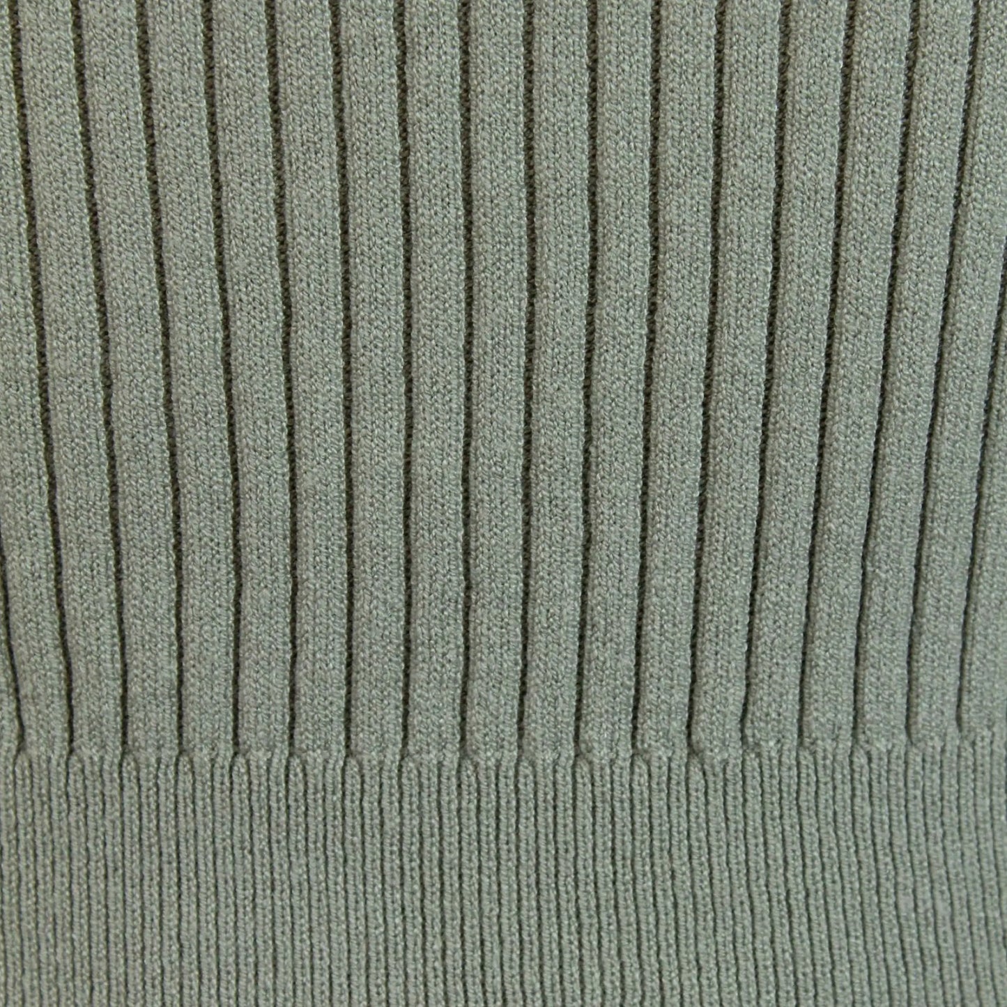 Detail of the ribbed knit texture on a long sleeve top