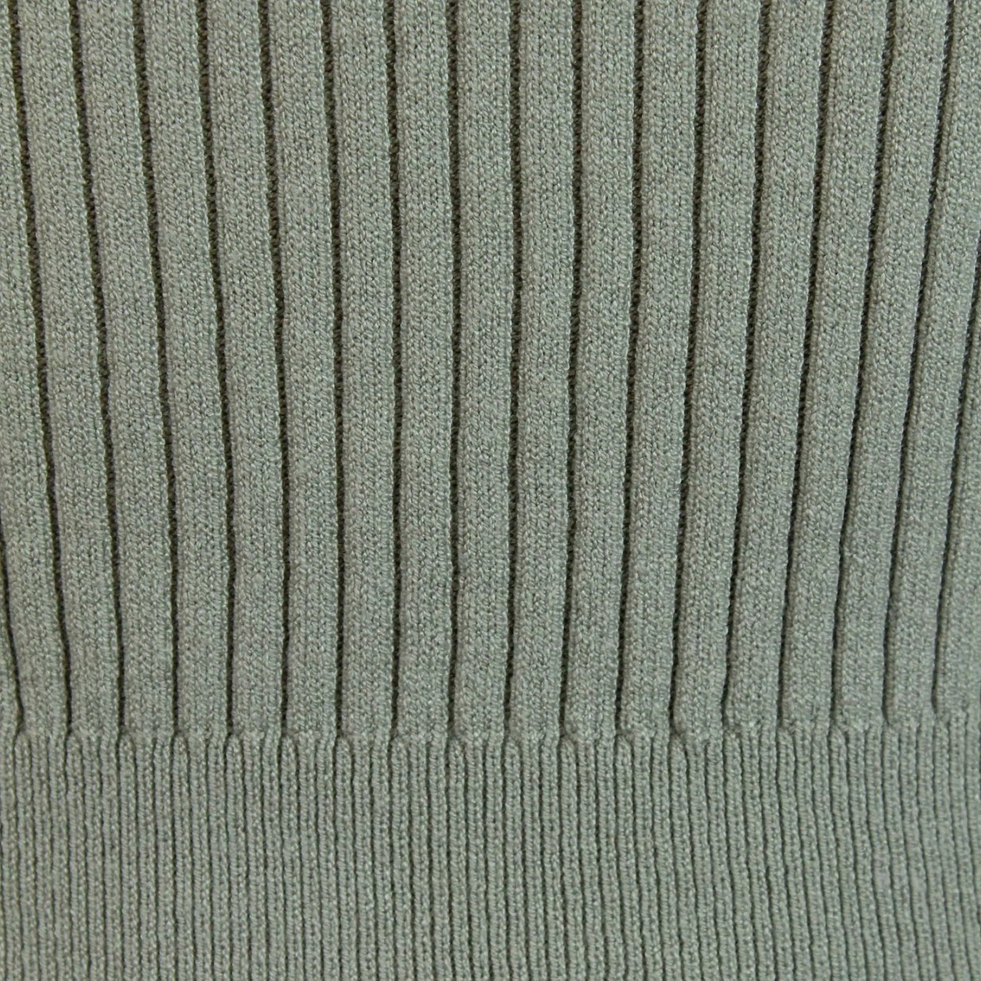 Detail of the ribbed knit texture on a long sleeve top