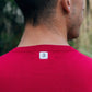 Back of Model showcasing the men's crew neck sweater in red