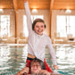 Boy on kid's shoulders in pool