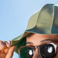 Closeup of a woman wearing a hat in the sun