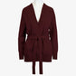 The Women's Callie Long Sleeve Front Tie Sweater in a rich burgundy color modeled on a white mannequin